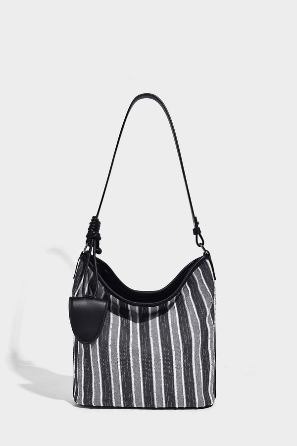 Large striped canvas hobo shoulder bag with cream trim and silver-tone hardware, detail view 9