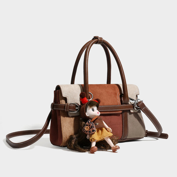 Structured color-block satchel bag in brown, rust, beige, and taupe suede-look panels with white topstitching, front buckle