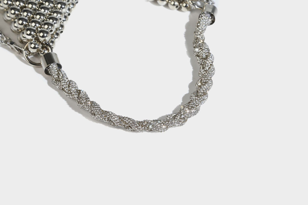 Small silver metallic beaded mini bag with braided rhinestone top handle and detachable chain crossbody strap, detail view 16