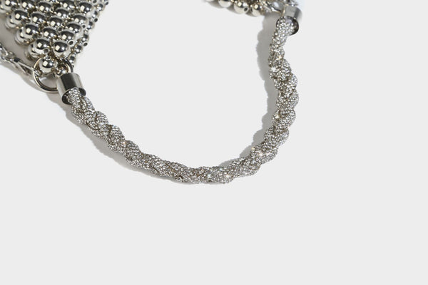 Small silver metallic beaded mini bag with braided rhinestone top handle and detachable chain crossbody strap, detail view 16