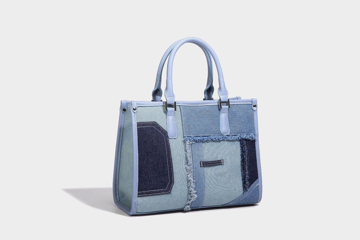 Structured patchwork denim tote bag with frayed panel seams, dual top handles, and silver-tone hardware, detail view 16
