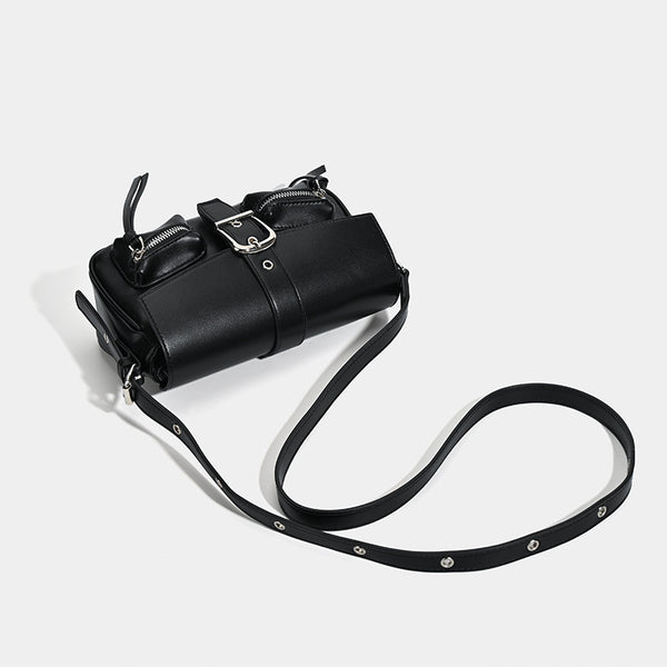 Structured flap crossbody bag with front buckle strap and dual zip pockets in smooth leather-look finish with silver-tone