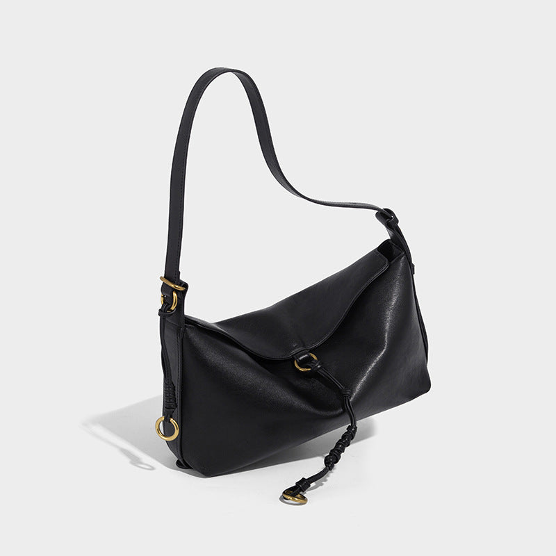 Slouchy brown leather-look shoulder bag with knotted drawcord tie closure, gold-tone ring hardware, and long adjustable