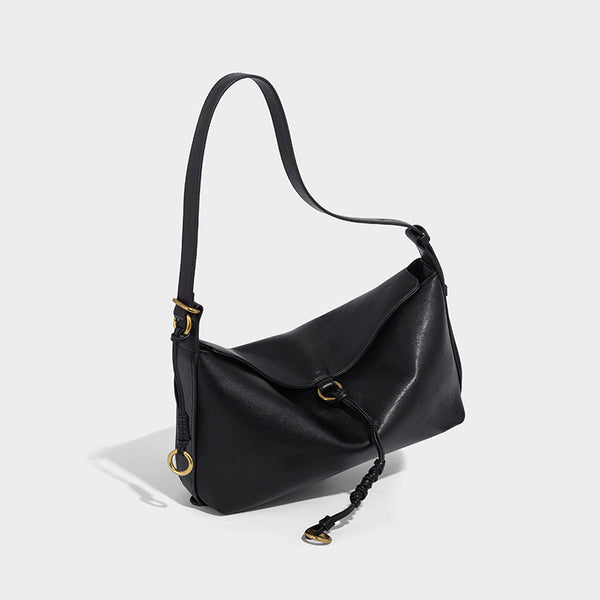 Slouchy brown leather-look shoulder bag with knotted drawcord tie closure, gold-tone ring hardware, and long adjustable