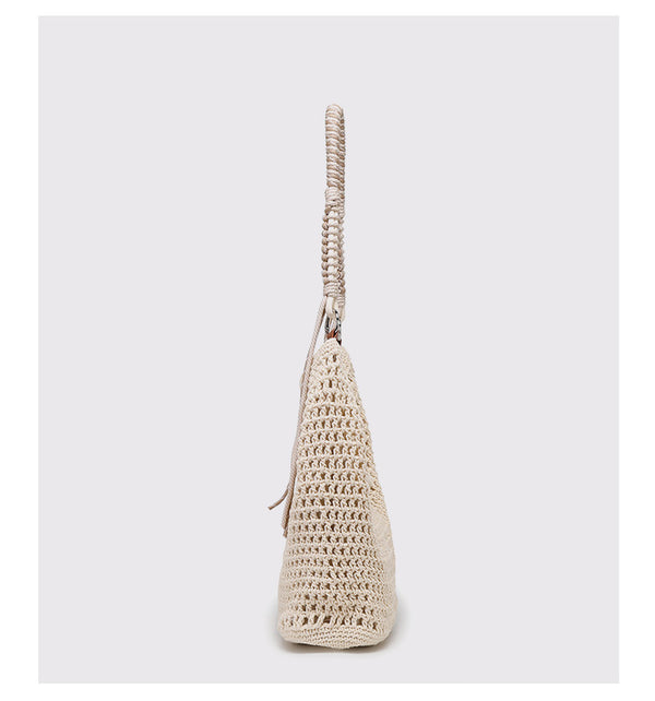 Große cremefarbene Hobo-Schultertasche aus Flechtmaterial mit geflochtenem Kordelriemen und Ringbeschlägen in Silberoptik, Detailansicht 9