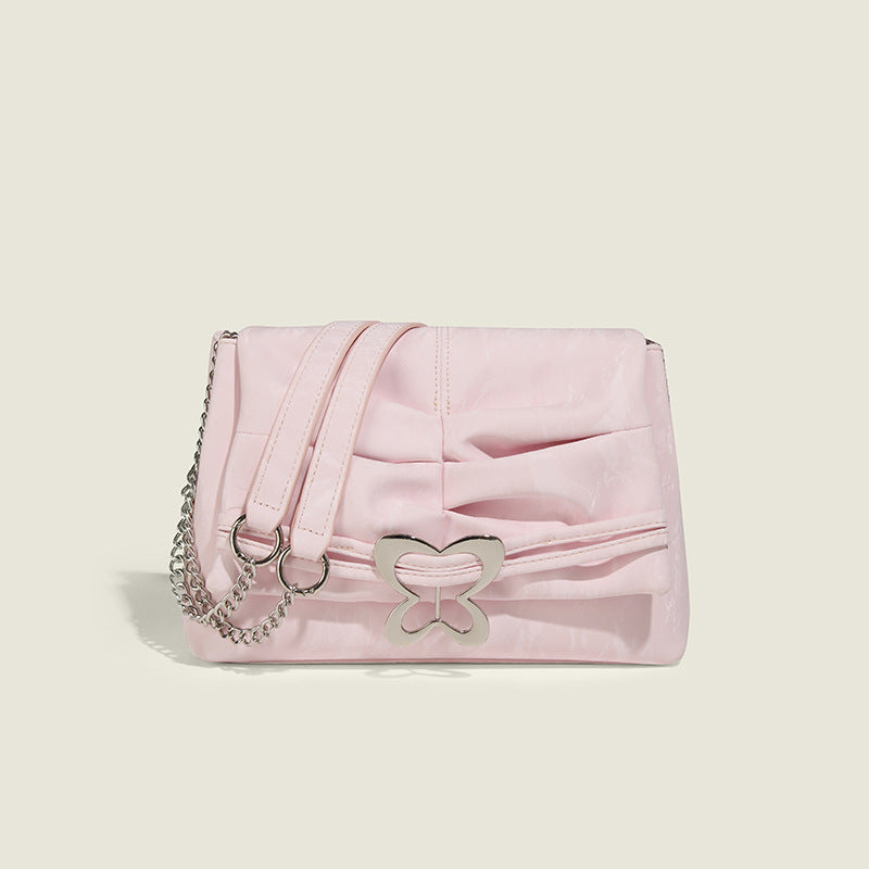 Structured rectangular chain shoulder bag with silver butterfly clasp and glossy crinkled finish, detail view 7