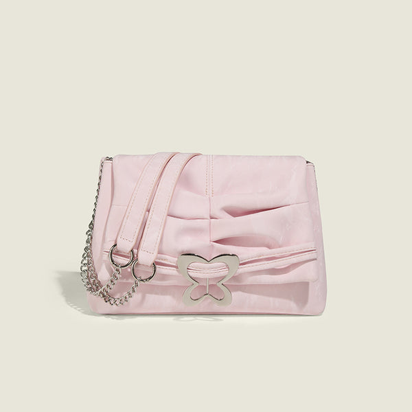 Structured rectangular chain shoulder bag with silver butterfly clasp and glossy crinkled finish, detail view 7