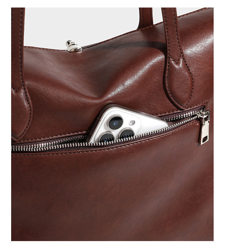 Large leather-look tote shoulder bag with slim double straps and silver-tone turn-lock closure, detail view 20