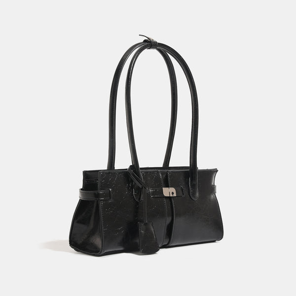 Structured glossy leather-look tote bag with long loop handles and silver turn-lock buckle closure, detail view 3