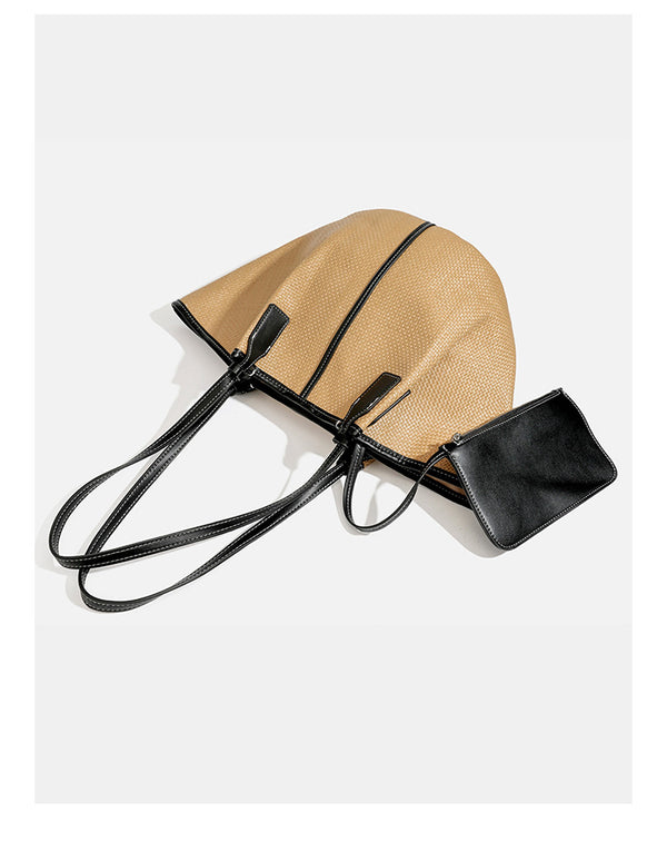 Tan woven tote bag with contrasting leather-look trim, long shoulder straps, and detachable rectangular zip pouch, detail