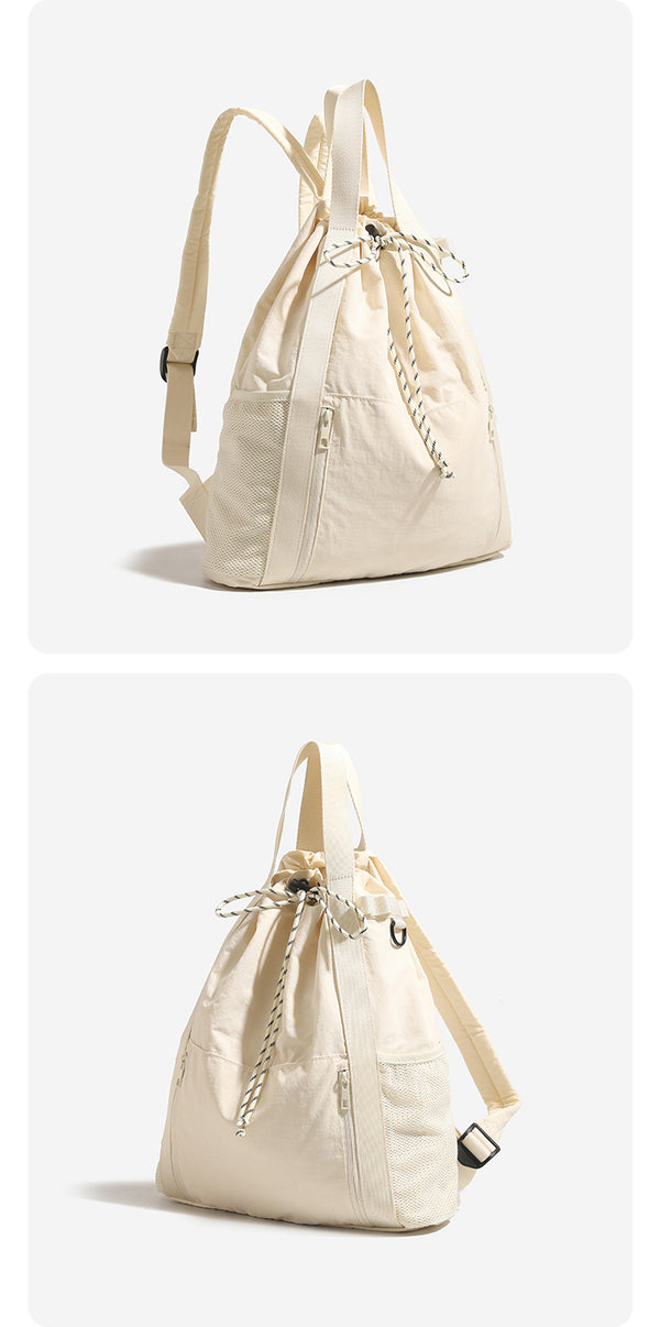 Soft matte drawstring backpack tote with braided cord closure, front zip pocket, and mesh side panels, detail view 8