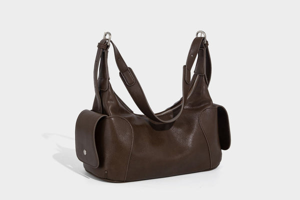 Soft pebbled leather-look hobo shoulder bag with zip top closure, side flap pockets, and silver-tone hardware, detail view 31