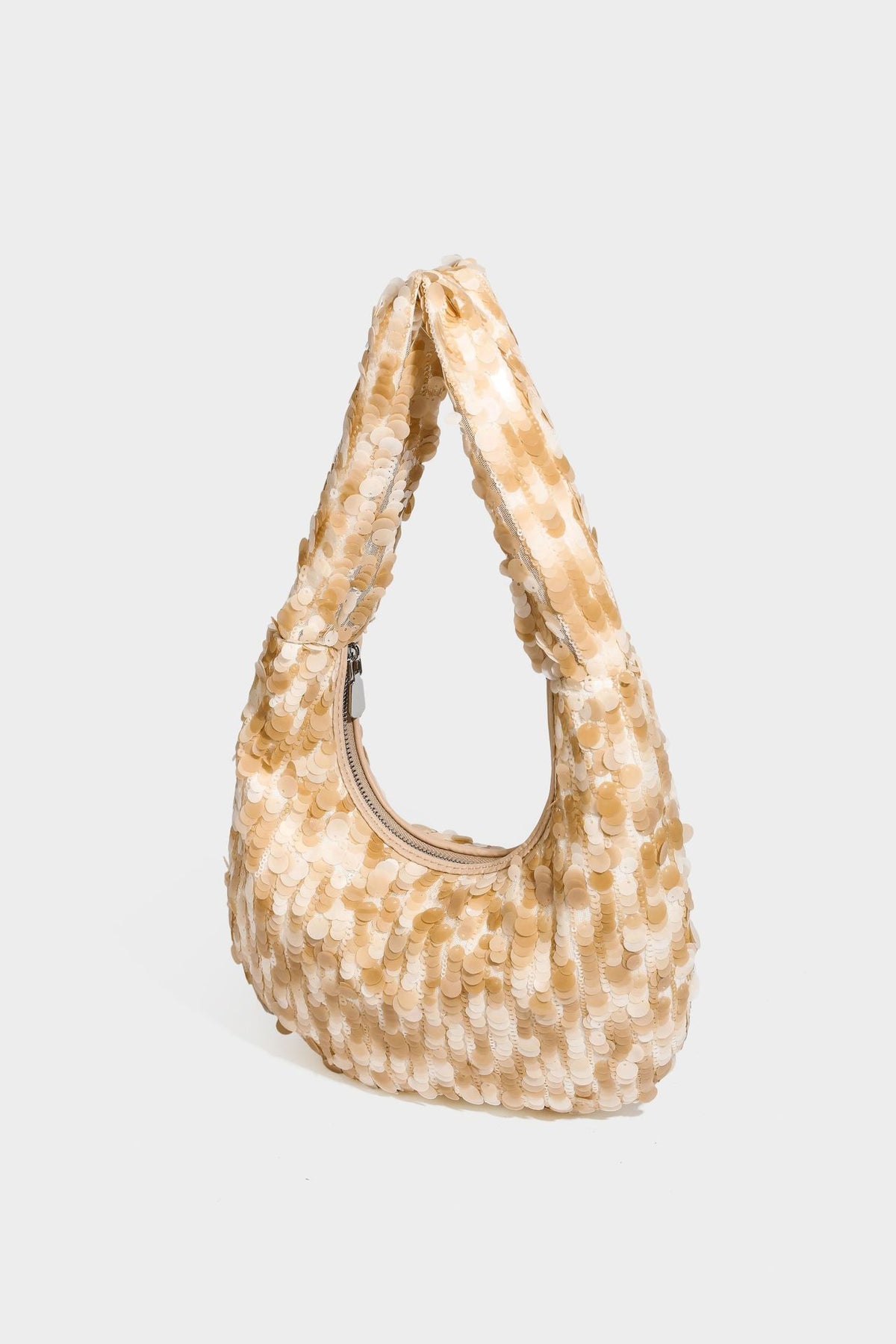 Slouchy crescent hobo shoulder bag covered in overlapping reflective sequin discs with a single integrated strap and top-zip