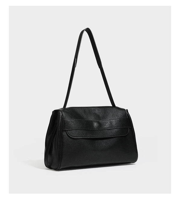 Structured rectangular flap shoulder bag in dark brown leather-look finish with long single strap and layered front panel
