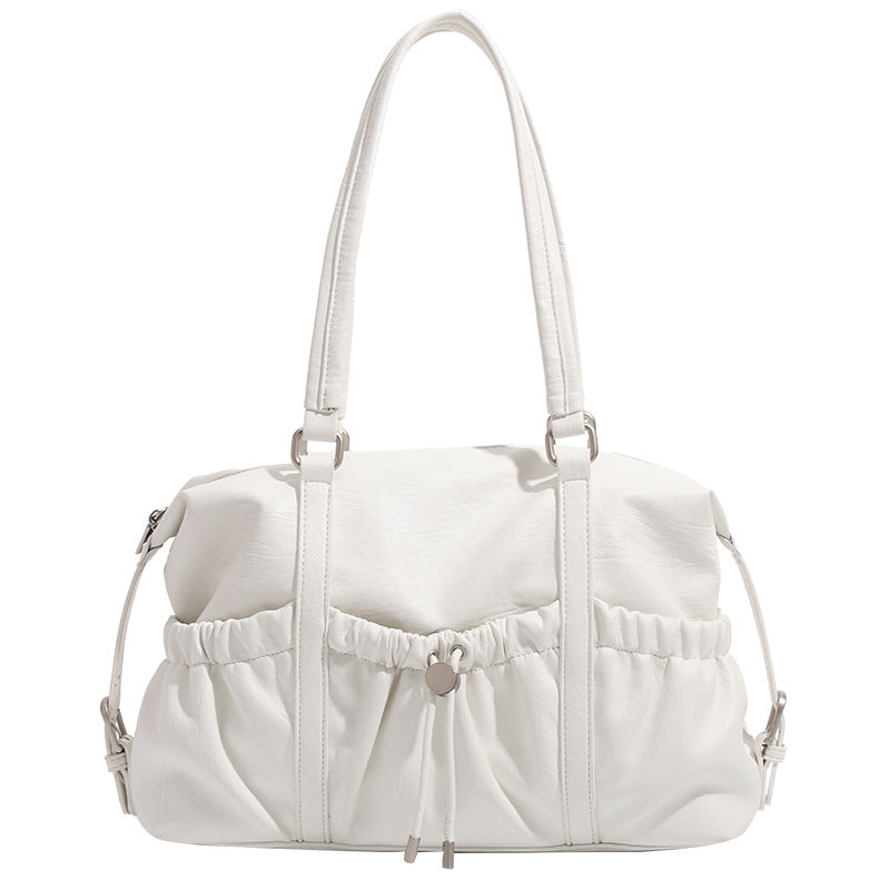 Ivory leather-look shoulder bag with ruched front panels, drawstring toggle, silver-tone hardware, and dual top handles