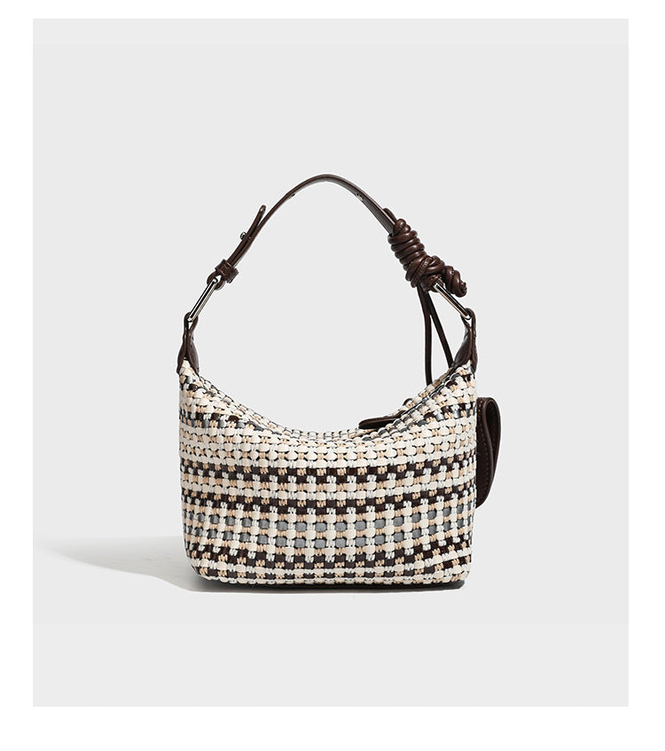 Small crescent shoulder bag in black-and-white woven textile with smooth black leather-look trim, zip-top closure, knotted