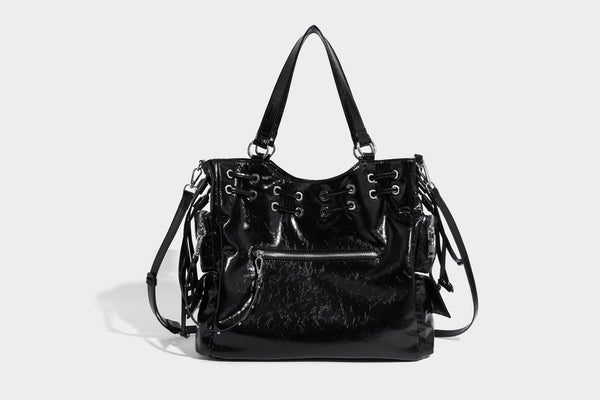 Glossy crinkled leather-look tote bag with silver grommet lace-up front detail, dual top handles, and detachable shoulder