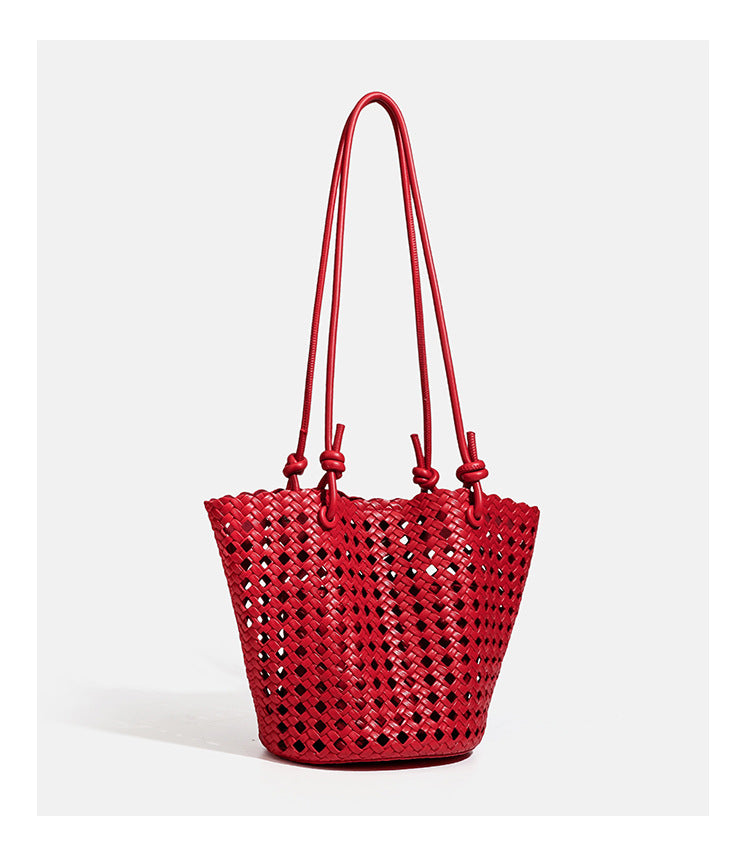 Open-weave lattice bucket tote bag with long knotted cord handles and tapered silhouette, detail view 21