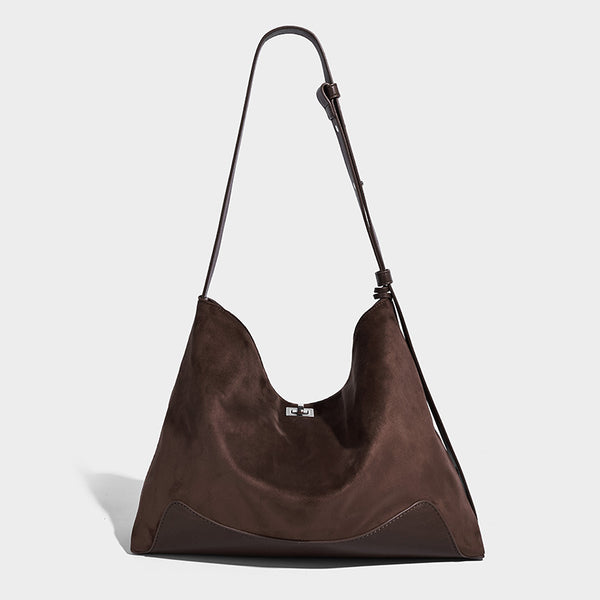 Dark brown slouchy hobo bag with matte suede-look body, smooth leather-look base trim, adjustable shoulder strap, and, detail