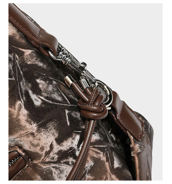 Slouchy hobo shoulder bag in crinkled metallic brown leather-look finish with braided rope knots, silver-tone hardware