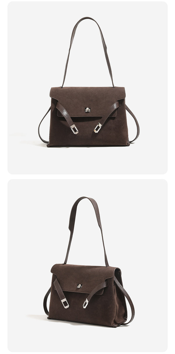 Structured trapezoidal flap satchel bag with silver-tone turn-lock clasp, decorative front strap tabs, gusseted sides, and