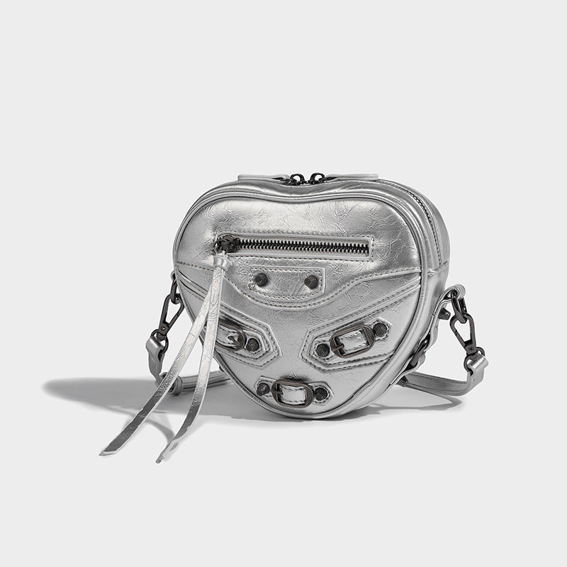 Mini heart-shaped crossbody bag with glossy crinkled finish and moto buckle hardware, detail view 28