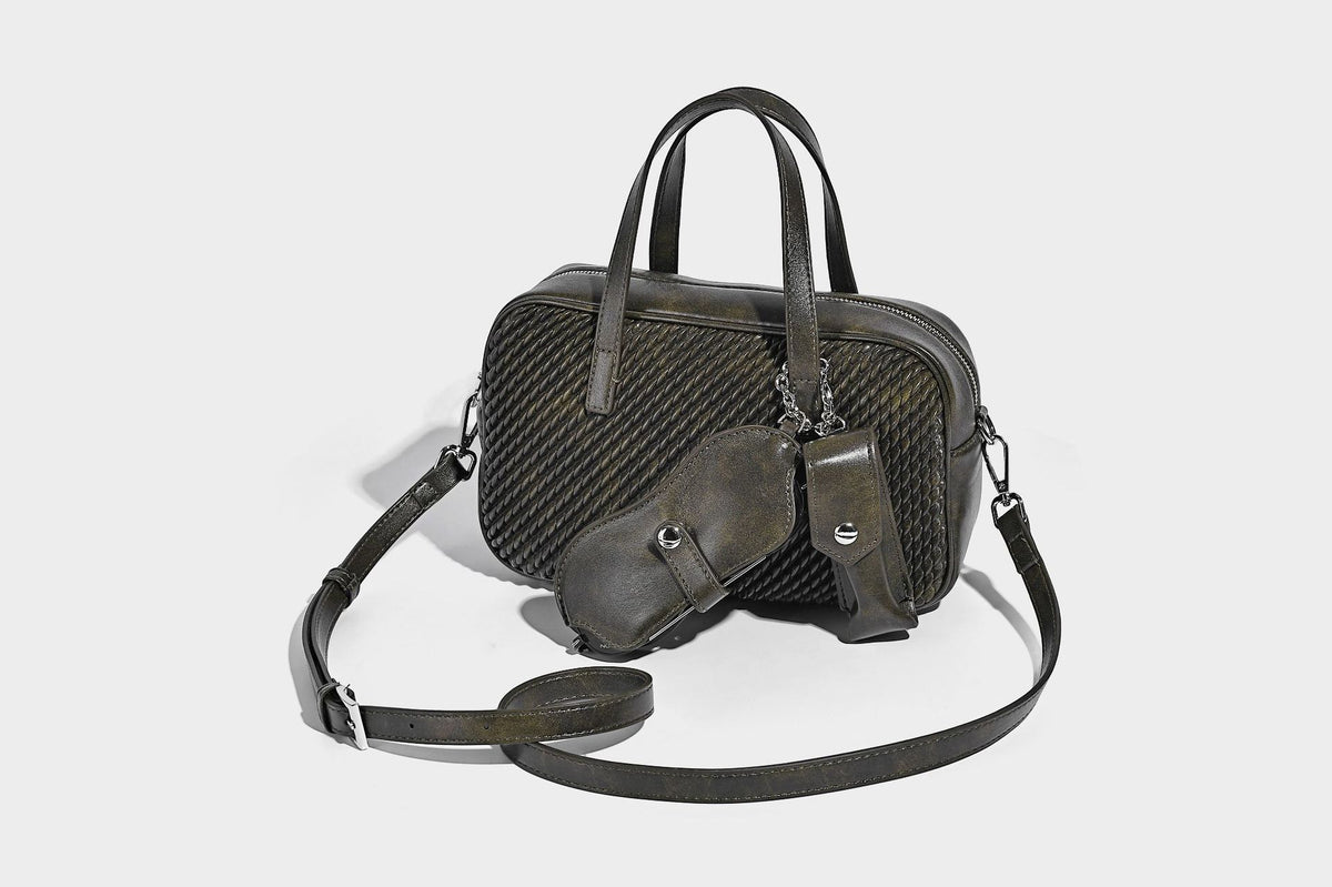 Structured woven-texture front top-handle handbag with zip closure, dual handles, detachable shoulder strap, and matching