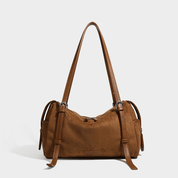 Large brown suede-finish barrel shoulder bag with dark leather-look trim, silver-tone zippers, dual top handles, and long