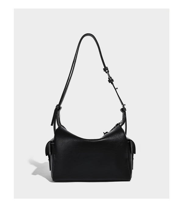 Small slouchy moto-style crossbody bag in smooth matte leather-look finish with white contrast stitching, silver-tone, detail