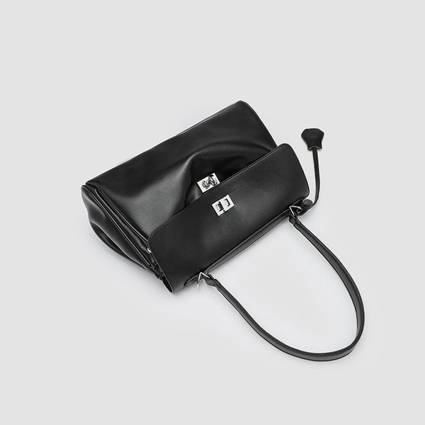 Structured black leather-look flap satchel bag with silver turn-lock hardware and top handle, detail view 4