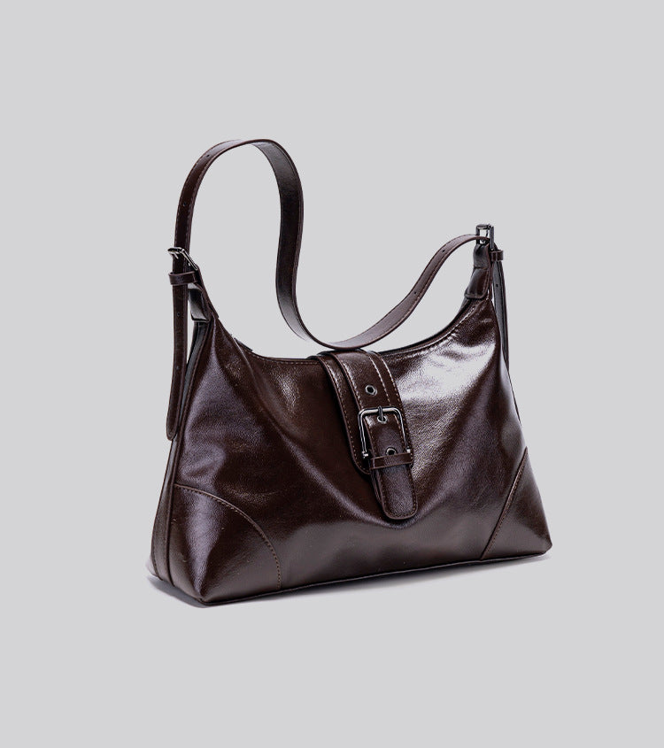 Glossy dark brown slouch hobo shoulder bag with front buckle strap panel and long adjustable single strap, detail view 12