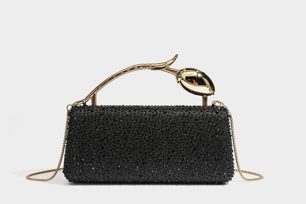 rectangular hard-case rhinestone evening clutch with sculptural gold-tone branch-and-bud top handle and detachable chain