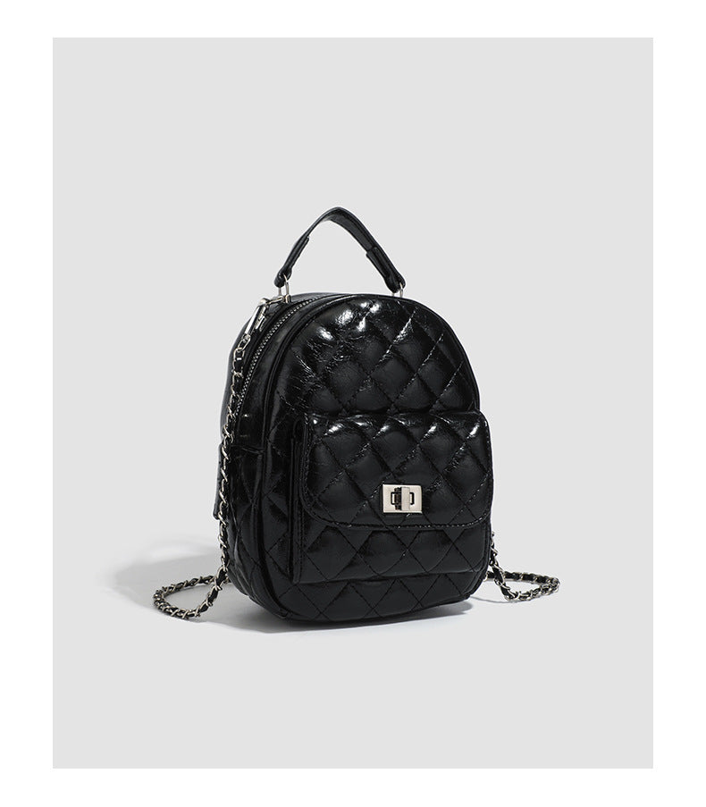 Quilted leather-look backpack purse with chain strap and turn-lock front pocket, detail view 19