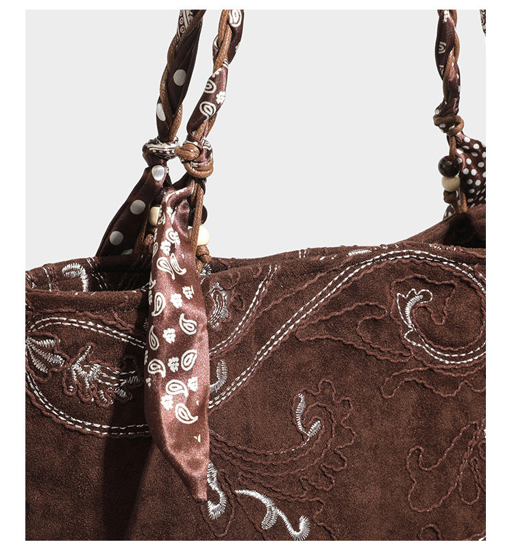 Brown suede-finish tote bag with paisley embroidery and braided fabric-ribbon shoulder strap, detail view 32