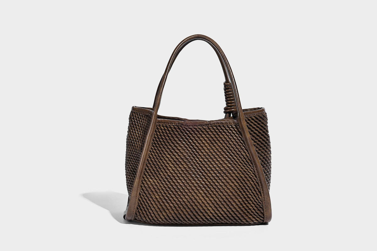 Large structured woven rope-texture tote bag with smooth leather-look trim, knotted dual top handles, detachable mini front