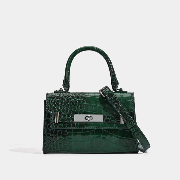 Strukturierte Mini-Henkeltasche in glänzender Lederoptik mit Krokoprägung und silberfarbenem Drehverschluss und