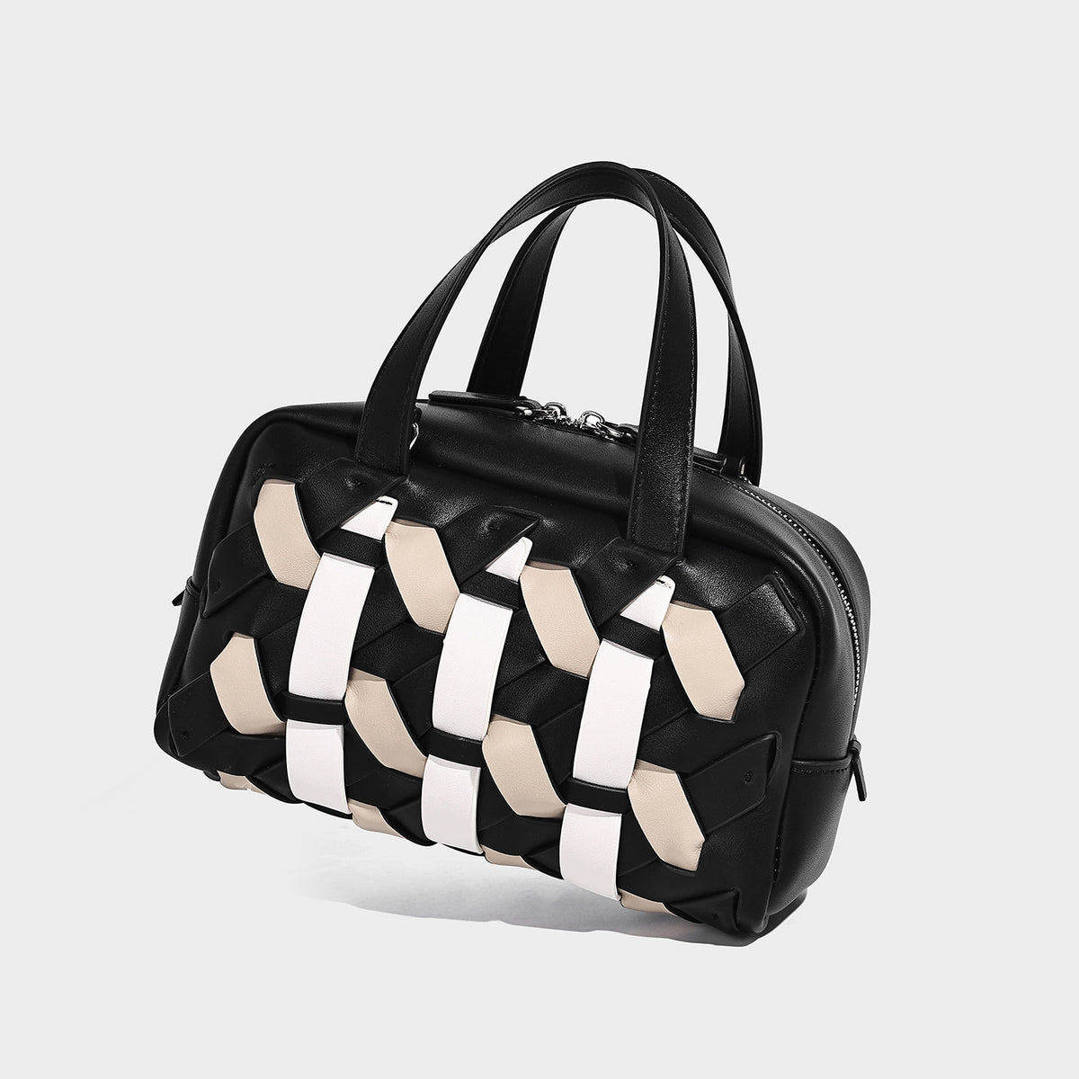 Small structured satchel bag with two-tone woven front panel, dual top handles, and detachable crossbody strap in tan brown