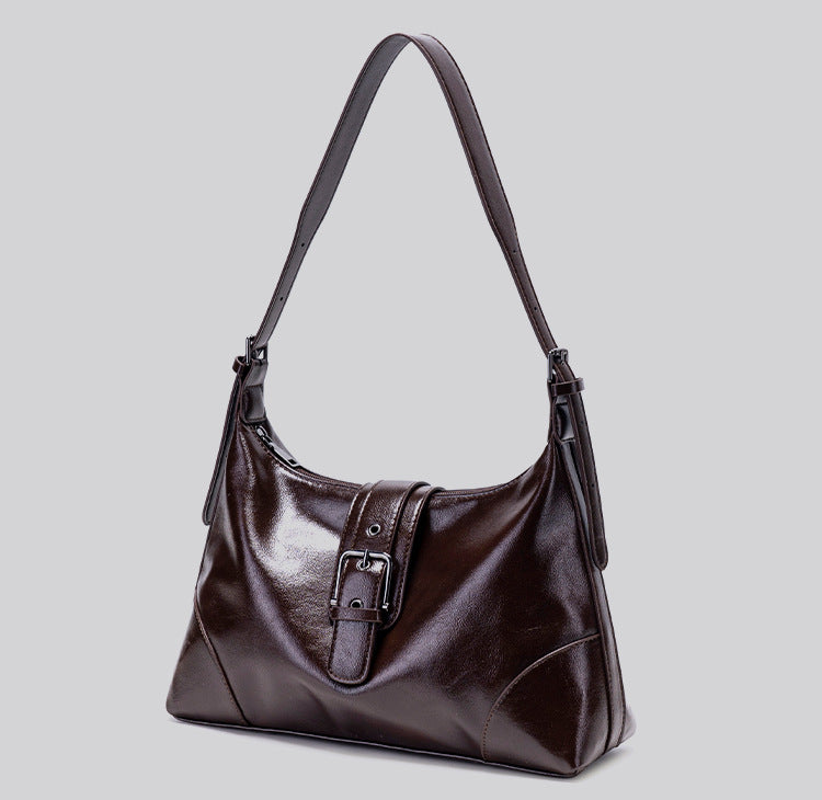 Glossy dark brown slouch hobo shoulder bag with front buckle strap panel and long adjustable single strap, detail view 11