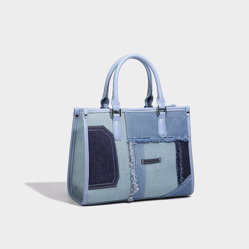 Structured patchwork denim tote bag with frayed panel seams, dual top handles, and silver-tone hardware, detail view 6