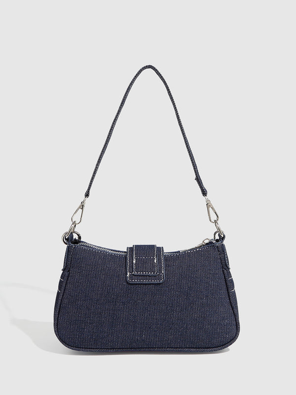 Dark navy denim-look shoulder bag with light blue and pink star appliqués, silver-tone buckle, chain strap, and short top