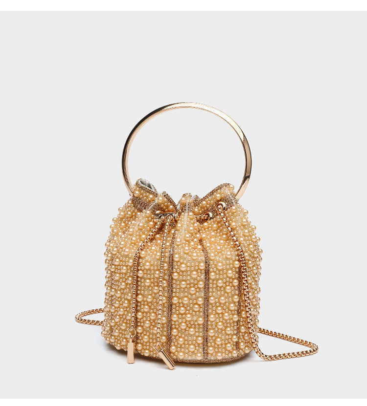 Small pearl-beaded drawstring bucket bag with silver-tone ring top handle and chain shoulder strap, detail view 17
