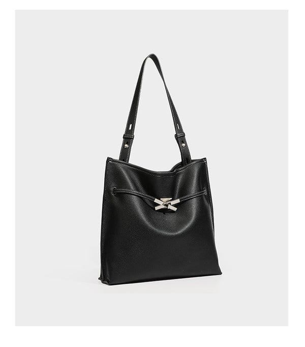 Pebbled leather-look tote bag with front toggle hardware and long shoulder strap, detail view 16