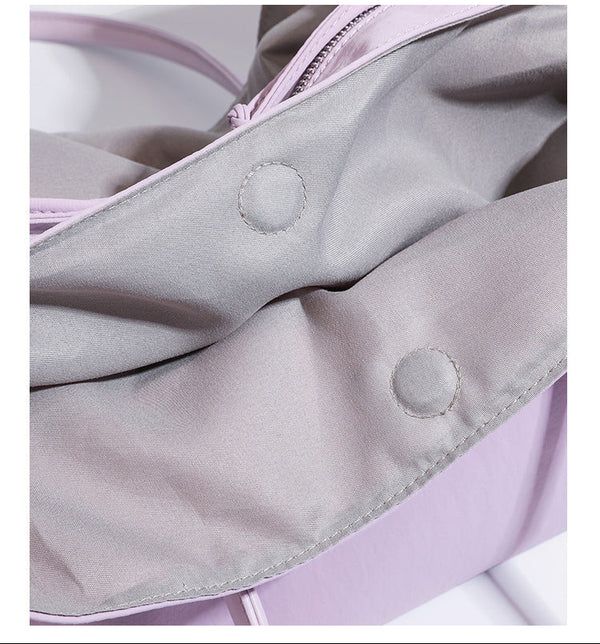 Large soft nylon tote bag with long double handles and zippered top in lavender, detail view 17