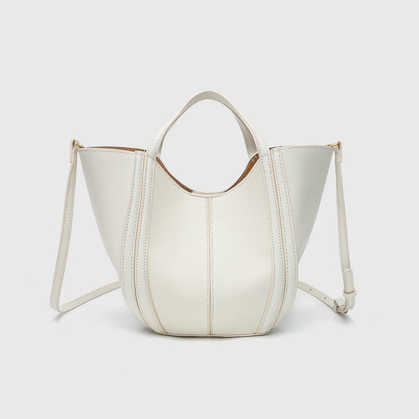 Structured open-top tote bag in tan brown pebbled leather-look finish with vertical seam accents, black edge piping, curved
