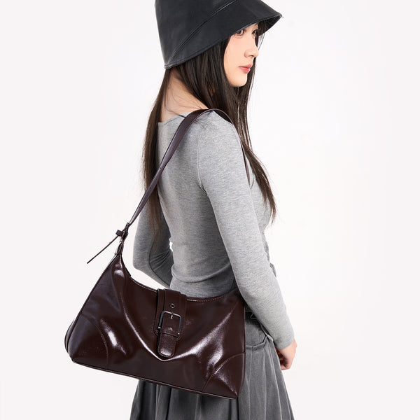 Glossy dark brown slouch hobo shoulder bag with front buckle strap panel and long adjustable single strap, detail view 3