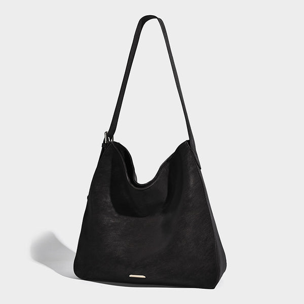 Large slouchy hobo shoulder bag in matte leather-look finish with adjustable strap and gold-tone bar hardware, detail view 7