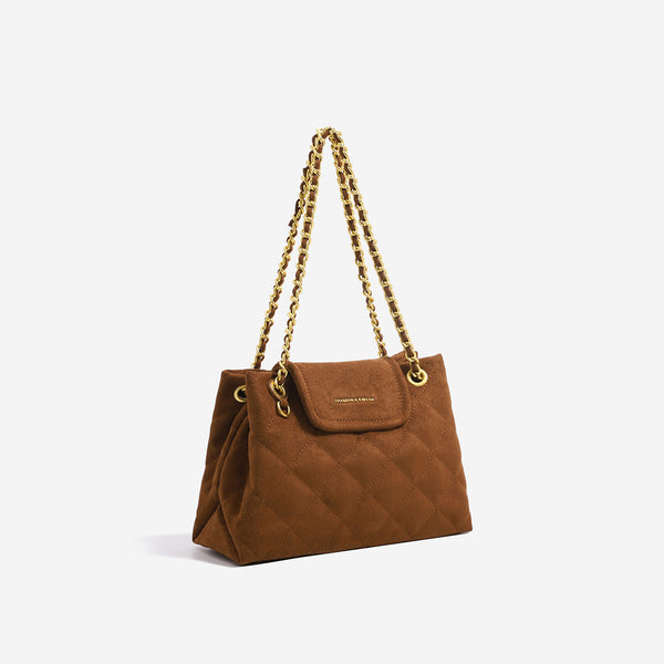 Structured diamond-quilted glossy black shoulder tote bag with interwoven silver chain strap and front flap snap pocket