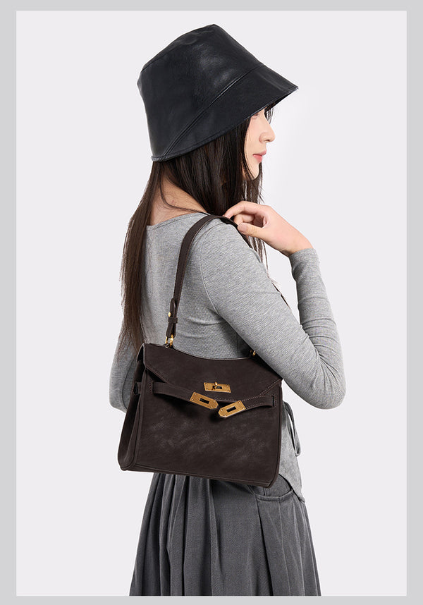 Structured dark brown flap satchel with gold-tone turn-lock hardware and detachable shoulder strap, detail view 11
