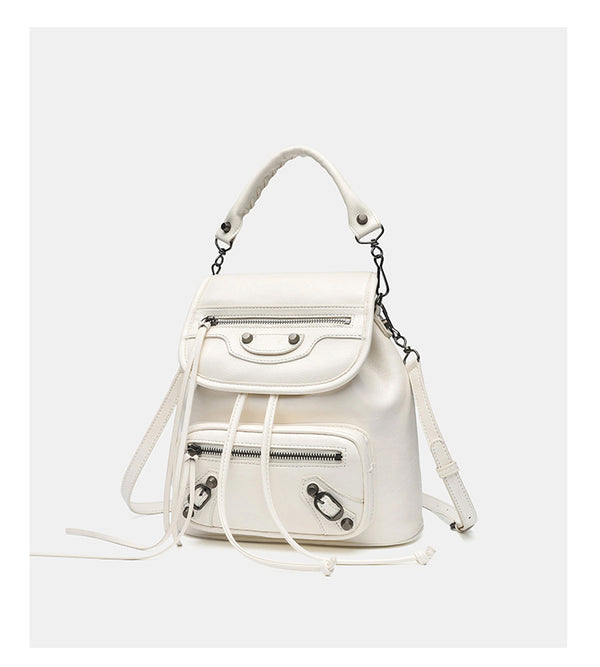 Small structured glossy leather-look convertible backpack handbag in black with flap closure, front zip pockets, metal stud