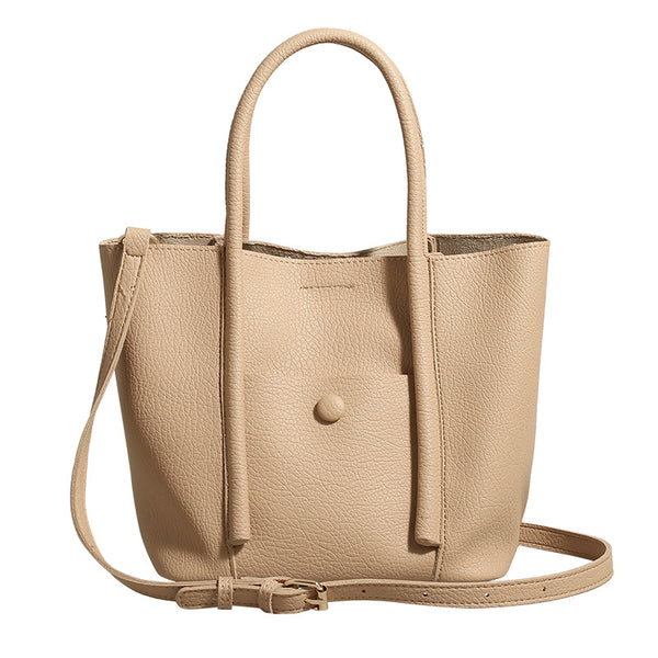Structured pebbled matte tote bag with front snap pocket, dual top handles, and detachable zip pouch in almond beige, detail